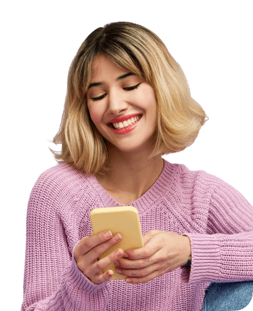 Woman holding phone and smiling